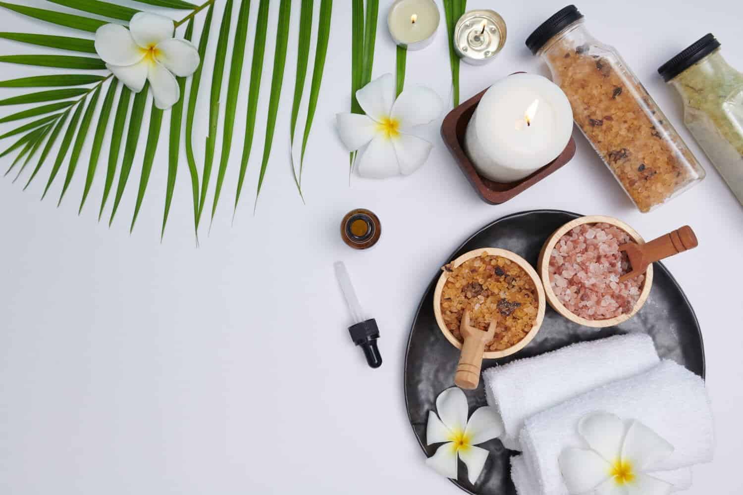 spa-concept-beauty-fashion-concept-with-spa-set-perfumed-flowers-water-relaxation-zen-spa-setting-flat-lay-with-bowl-bath-salt-flowers-towel-natural-soap-top-view-scaled Thiết Kế Spa