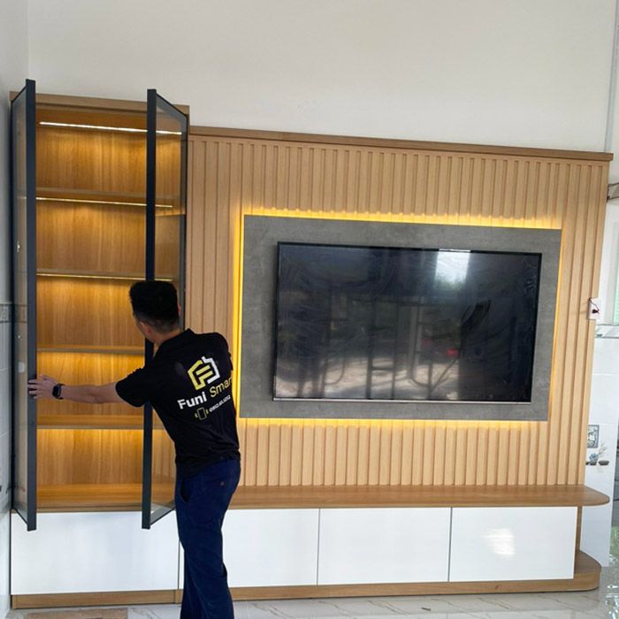 thi công kệ tivi gỗ căn hộ 13 Hệ kệ tivi MDF từ cánh kính phòng khách nhà phố