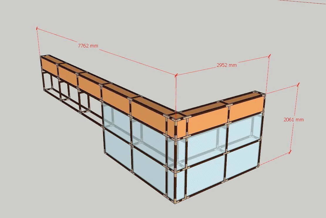 Bản vẽ mô hình 3D khung quầy bẻ góc với các khoang và đường ghi kích thước màu đỏ